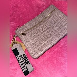 Steve Madden quilted large wristlet in mauve color.